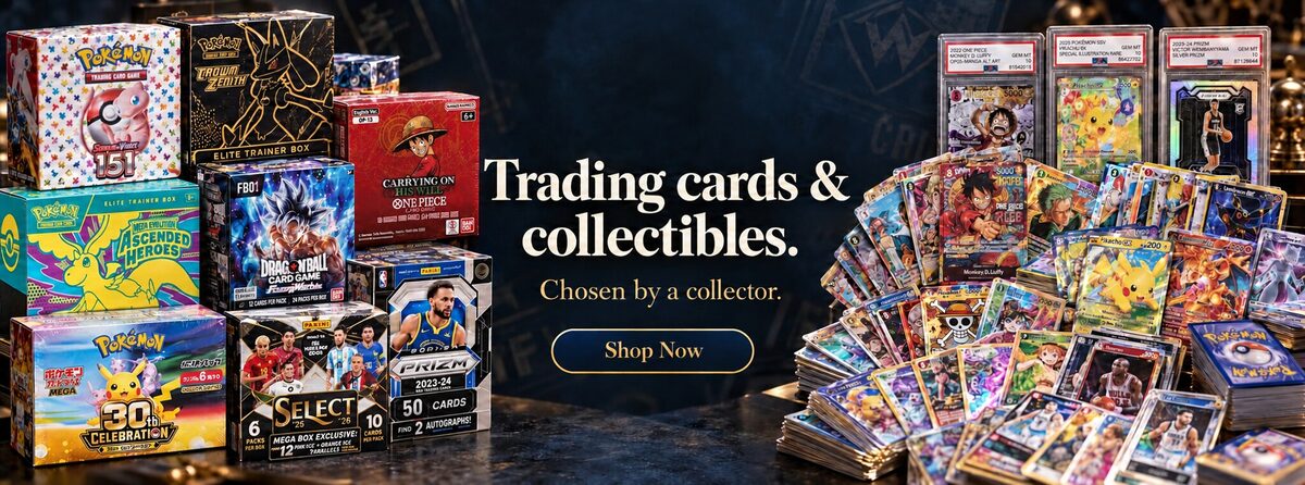 Sealed trading card boxes on the left and raw and graded cards on the right